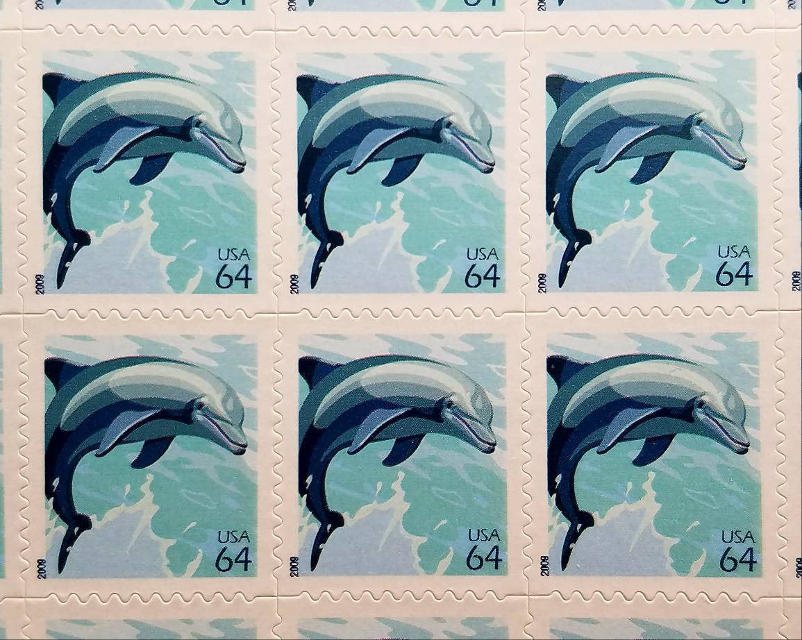 Five (5) vintage unused postage stamps - Dolphin // 64 cent stamps // Face value 3.20