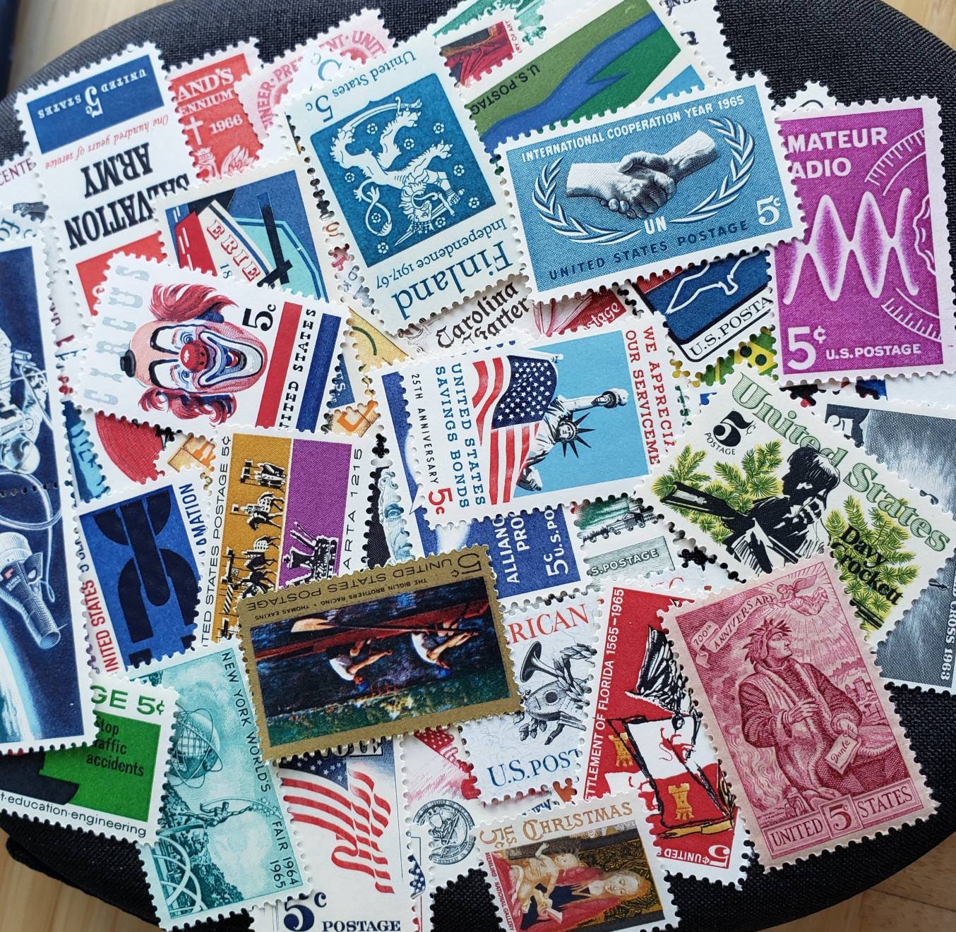 Twenty five (25) vintage unused 5-cent 1960s postage stamps. All different. Face value = 1.25 dollars.